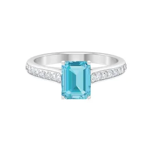 2.50 CT Emerald Cut Swiss Blue Topaz Solitaire with Diamond Side Stone Ring