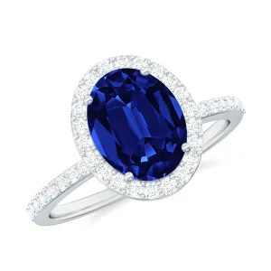 Oval Cut Created Blue Sapphire and Diamond Halo Engagement Ring