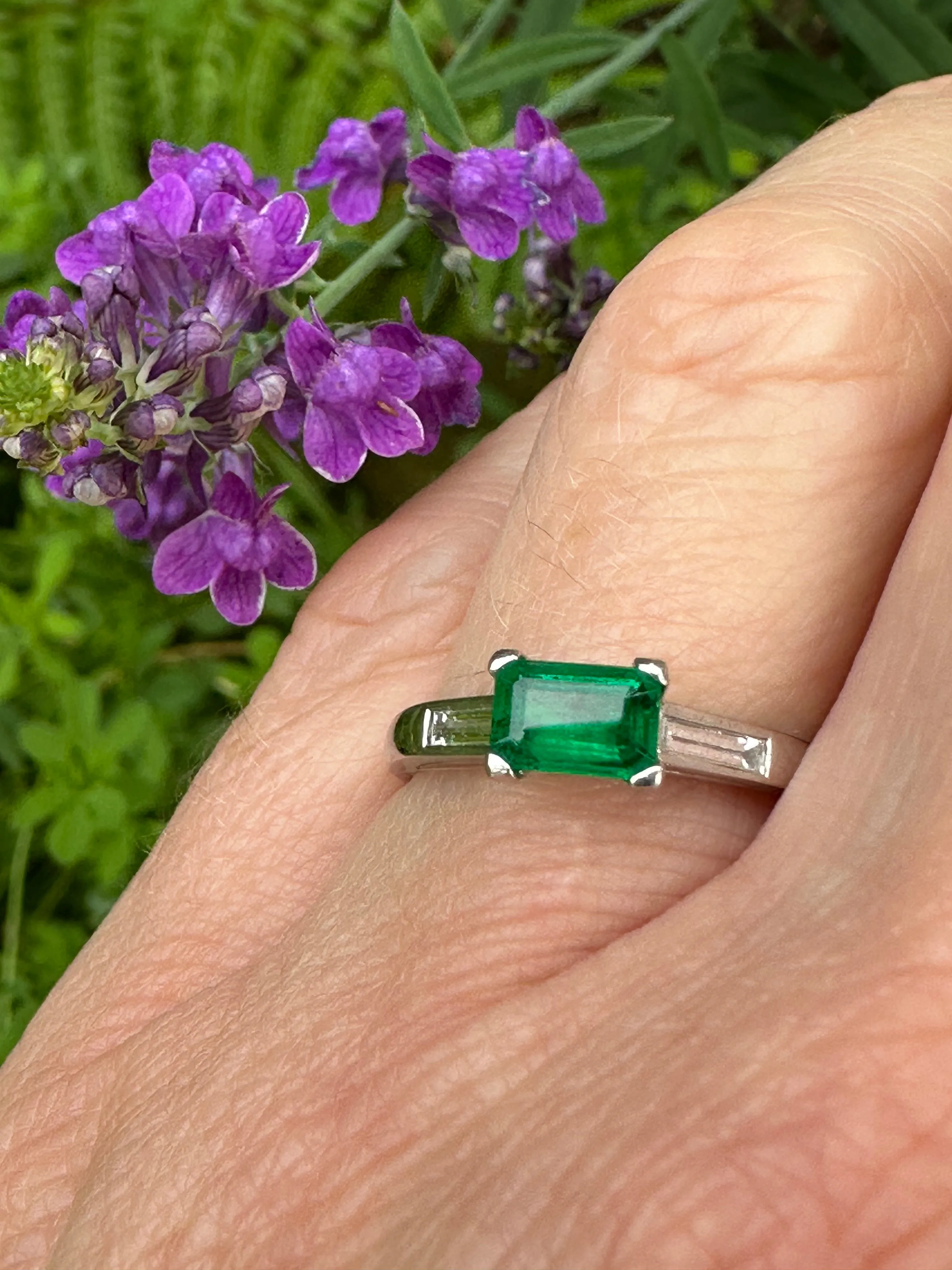 Platinum & emerald ring with baguette diamonds